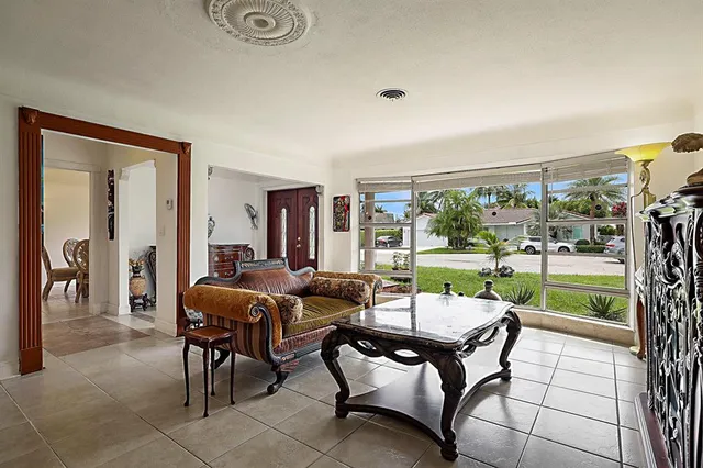a view of a livingroom with furniture and a window