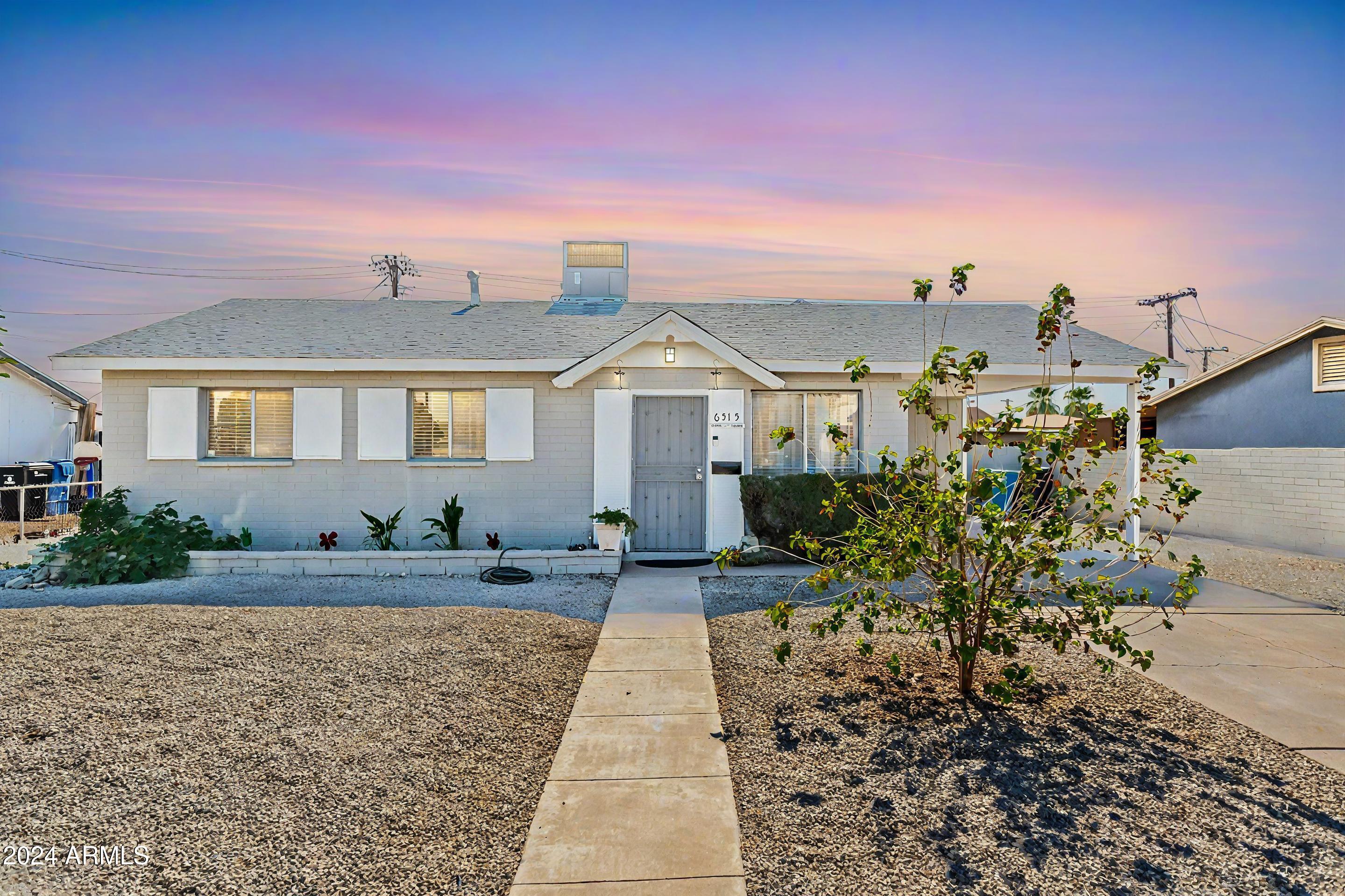 6515 West Cheery Lynn Road Phoenix, AZ 85033 - Photo 1 of 12 Front Center Sunset