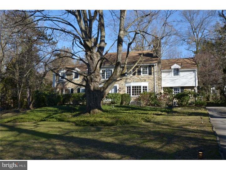 245 Mcclenaghan Mill Road Wynnewood, PA 19096 - Photo 2 of 22 a front view of a house with a yard