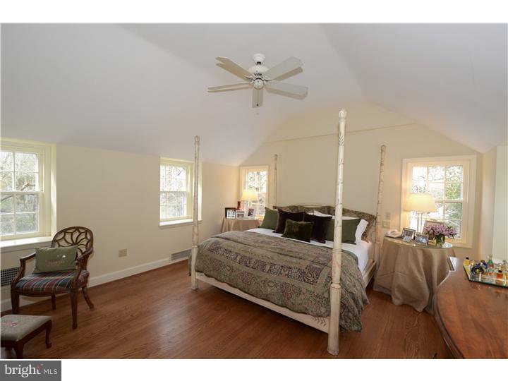245 Mcclenaghan Mill Road Wynnewood, PA 19096 - Photo 11 of 22 a living room with a bed furniture and a window