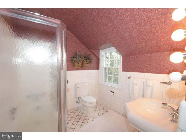 245 Mcclenaghan Mill Road Wynnewood, PA 19096 - Photo 16 of 22 a bathroom with a toilet sink and mirror
