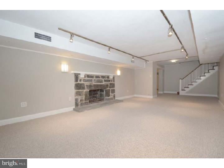 245 Mcclenaghan Mill Road Wynnewood, PA 19096 - Photo 19 of 22 a view of empty room with fireplace