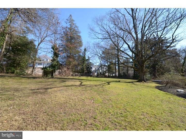 245 Mcclenaghan Mill Road Wynnewood, PA 19096 - Photo 21 of 22 a swimming pool with trees in the background