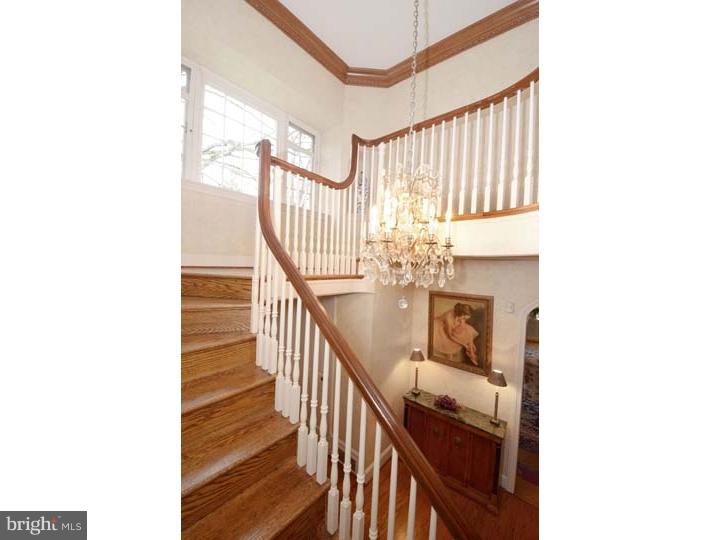 245 Mcclenaghan Mill Road Wynnewood, PA 19096 - Photo 4 of 22 a view of a hallway with wooden floor and entryway
