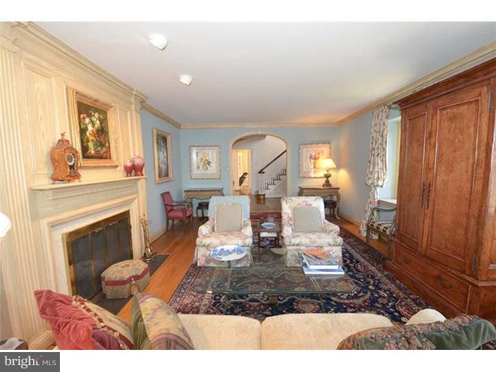 245 Mcclenaghan Mill Road Wynnewood, PA 19096 - Photo 9 of 22 a living room with furniture and a fireplace