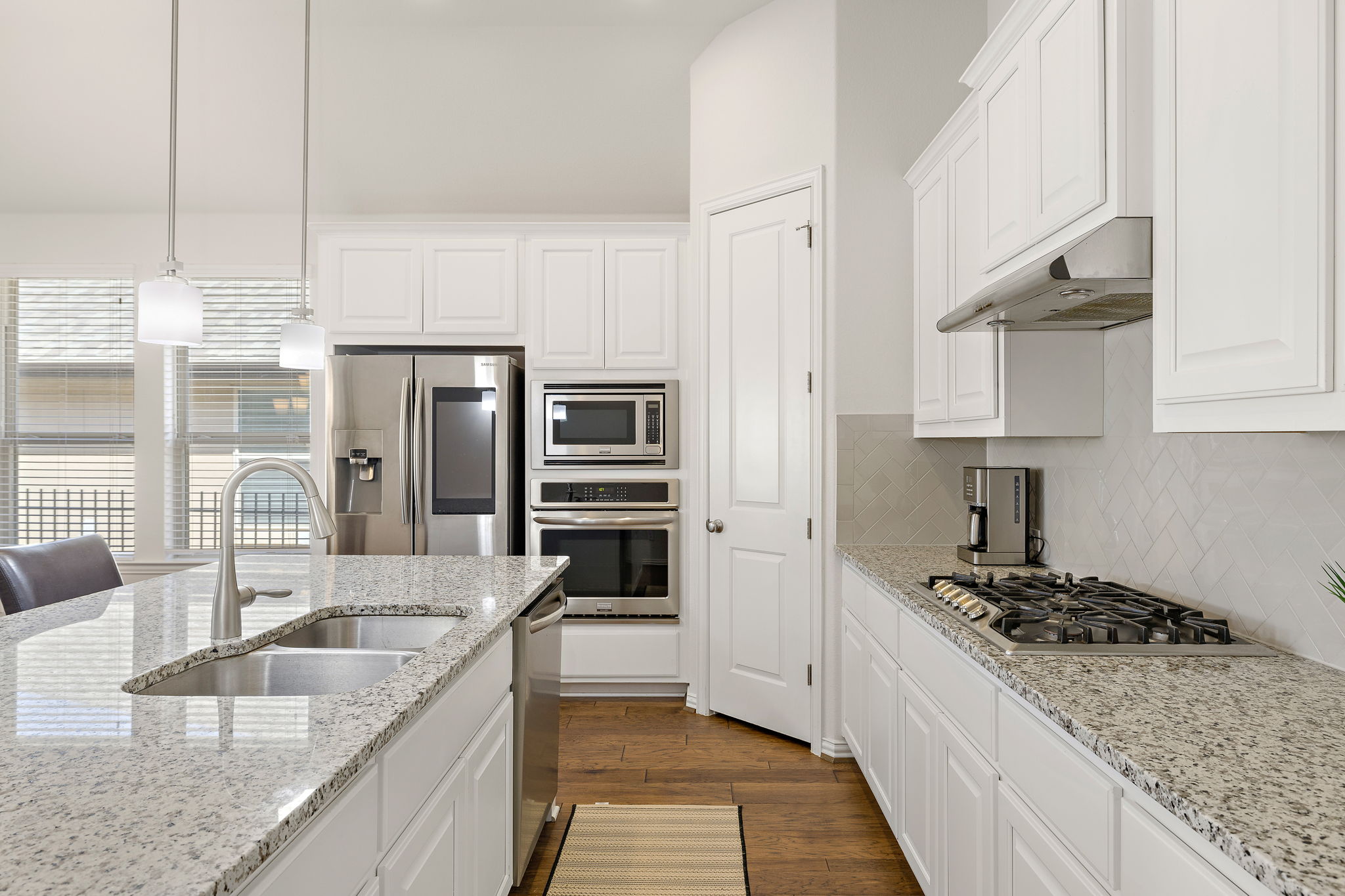 4201 Vespa Cove Leander, TX 78641 - Photo 6 of 29 a kitchen with stainless steel appliances granite countertop a sink stove and refrigerator
