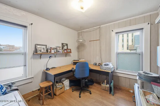 a workspace with furniture and a window