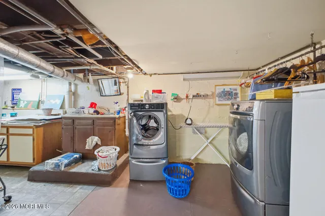 a storage room with washer and dryer