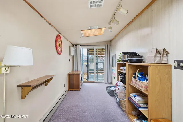 a room with furniture and a flat screen tv