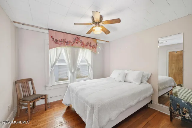 a bedroom with a bed and a chair