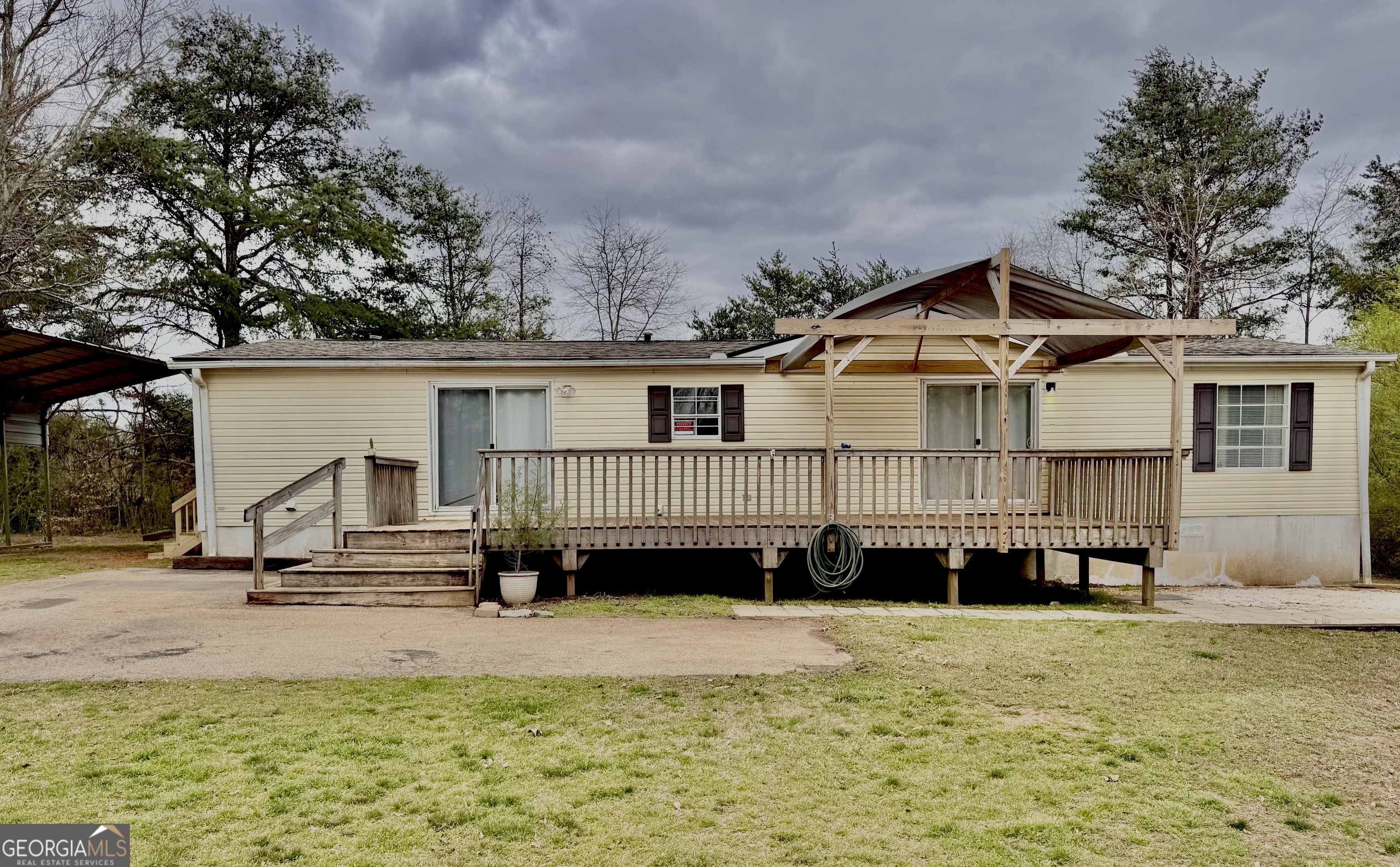 6570 Duncan Bridge Road Cleveland, GA 30528 - Photo 1 of 1 a view of a house with a yard