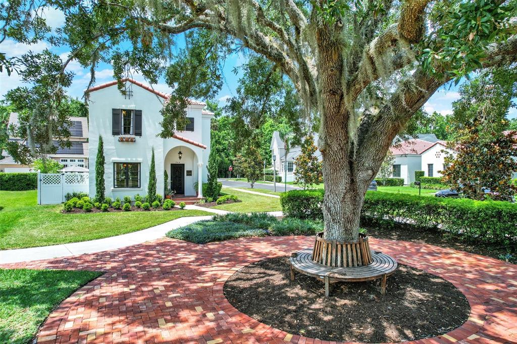 740 Oak Shadows Road Kissimmee, FL 34747 - Photo 1 of 1 a front view of a house with a yard and green space