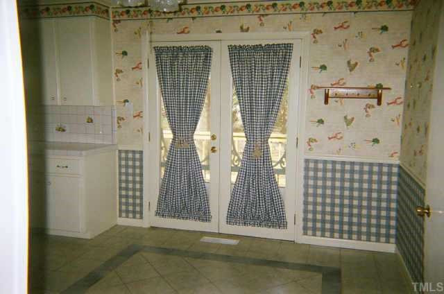 View of kitchen/dining area doors opening to the deck. Other