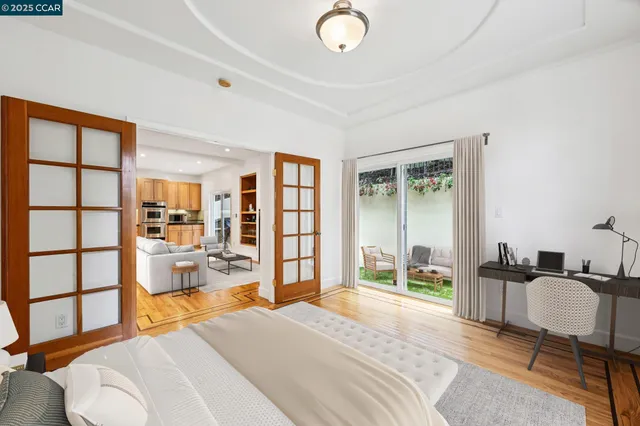 a bedroom with a large bed and a large window