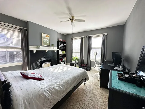 a bedroom with a bed and a table