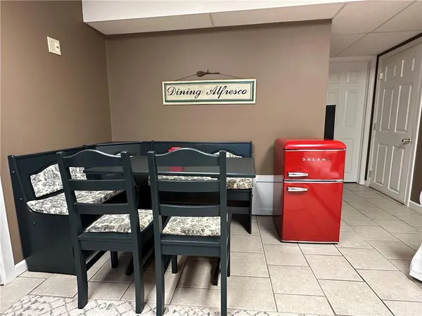 a view of a chairs and table in a room