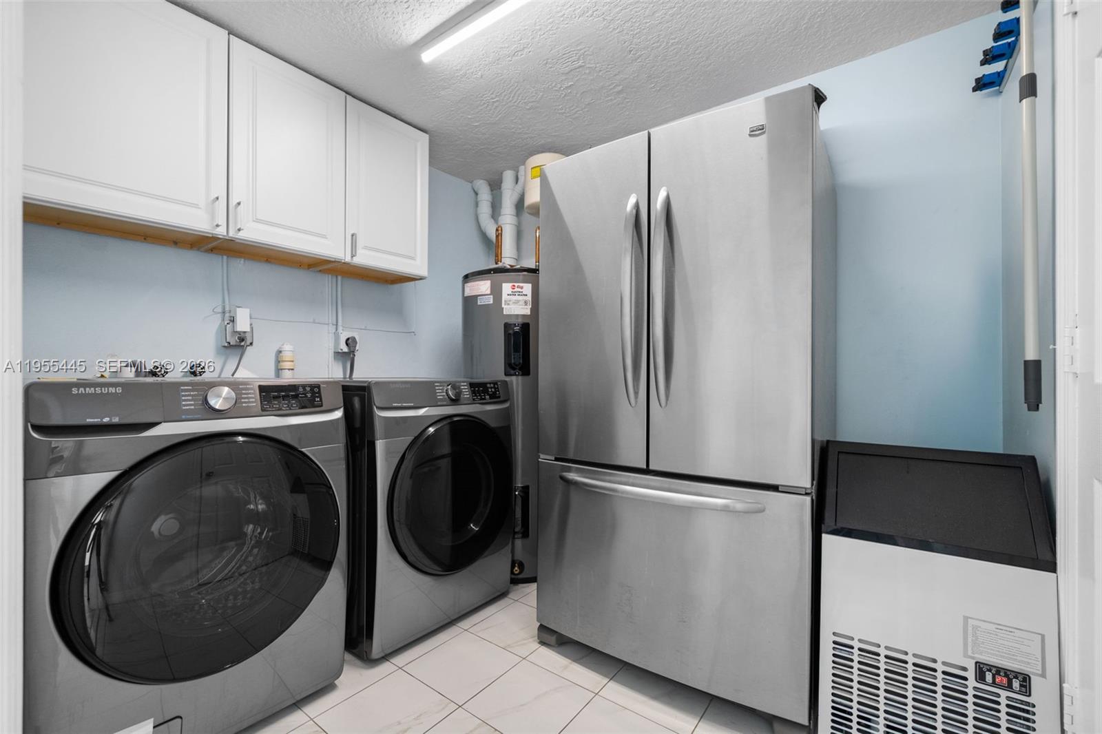 311 North Surf Road Hollywood, FL 33019 - Photo 39 of 61 a utility room with dryer and washer
