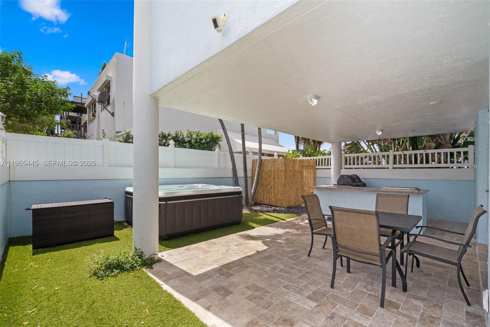 311 North Surf Road Hollywood, FL 33019 - Photo 46 of 61 a kitchen with a table and chairs in it
