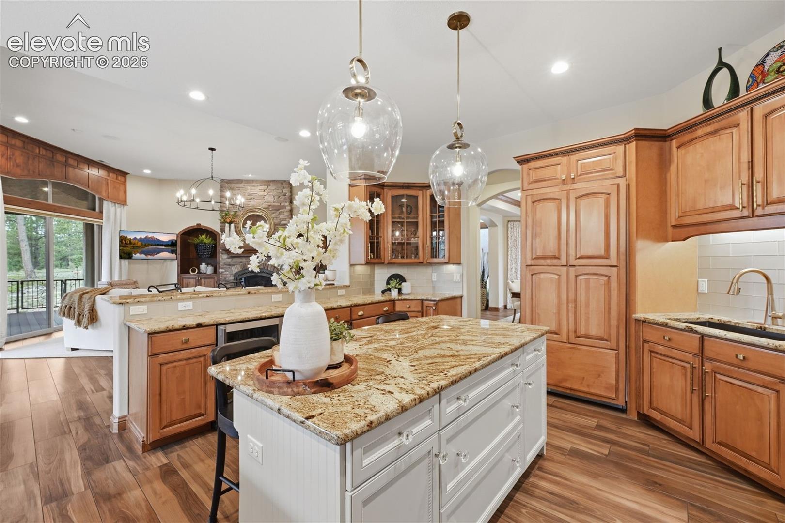 4865 Hidden Rock Road Colorado Springs, CO 80908 - Photo 9 of 50 Kitchen opens to family room for easy entertaining!
