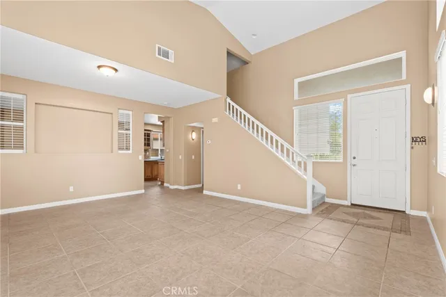 a view of an empty room with stairs