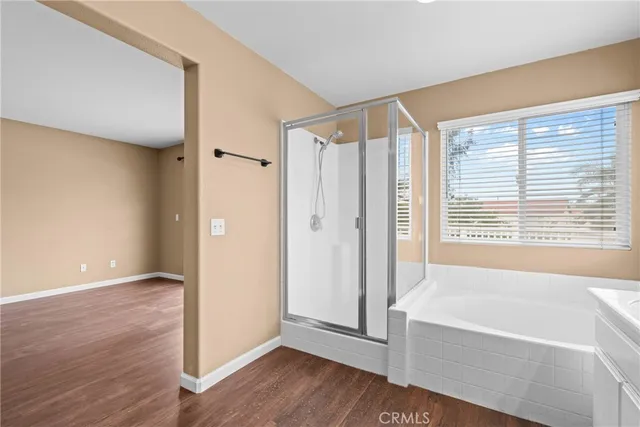 a bathroom with a bathtub and a shower