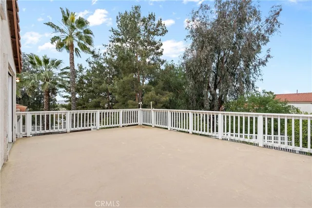 a view of a balcony with a trees