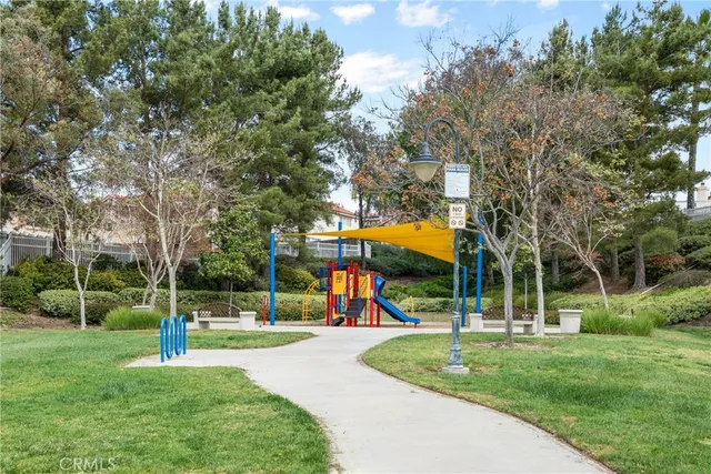 an aerial view of a house with a yard basket ball court and outdoor seating