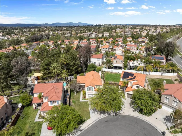 an aerial view of house with yard swimming pool and outdoor seating