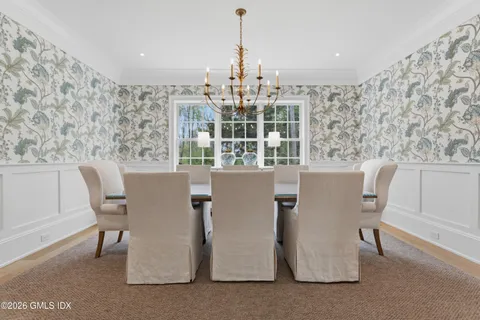 a dining room with furniture and window