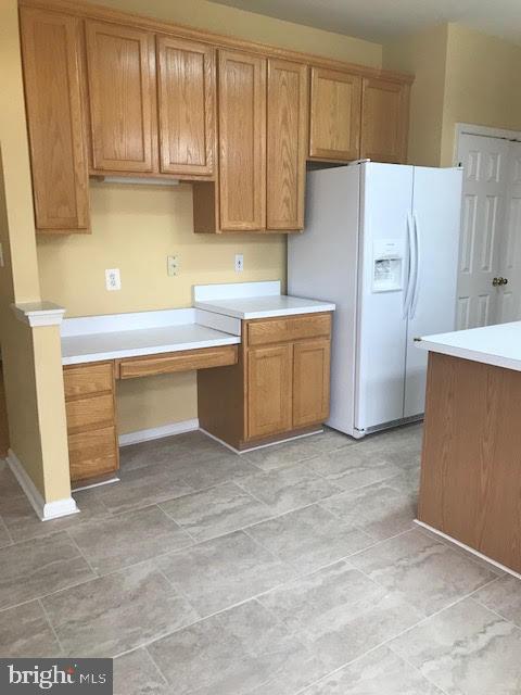 2025 Germander Way Woodbridge, VA 22192 - Photo 11 of 39 a kitchen with stainless steel appliances a refrigerator and cabinets