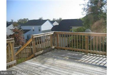 2025 Germander Way Woodbridge, VA 22192 - Photo 12 of 39 a view of a brick house with a small yard