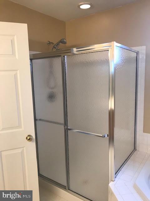 2025 Germander Way Woodbridge, VA 22192 - Photo 20 of 39 a bathroom with a glass shower door and a sink