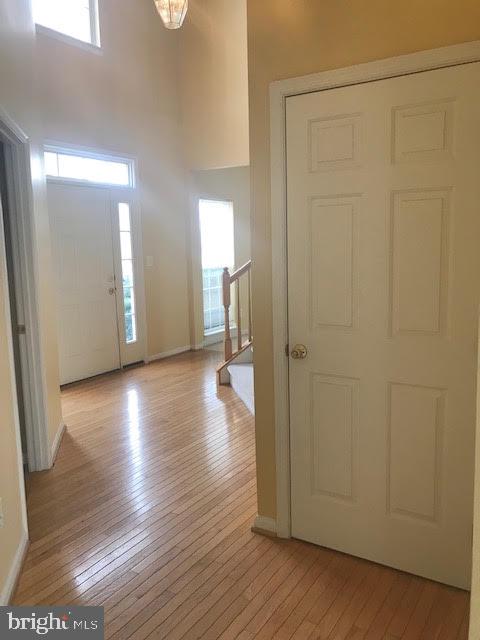 2025 Germander Way Woodbridge, VA 22192 - Photo 29 of 39 a view of a hallway with wooden floor