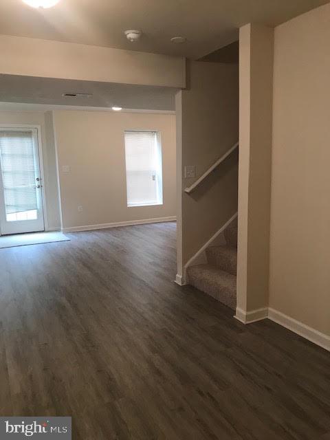 2025 Germander Way Woodbridge, VA 22192 - Photo 33 of 39 an empty room with wooden floor and windows