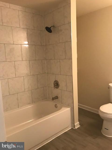 2025 Germander Way Woodbridge, VA 22192 - Photo 34 of 39 a white bath tub sitting next to a white toilet