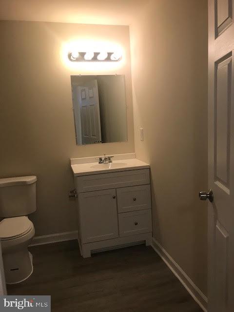 2025 Germander Way Woodbridge, VA 22192 - Photo 35 of 39 a bathroom with a toilet sink and mirror