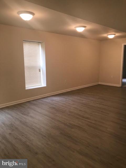 2025 Germander Way Woodbridge, VA 22192 - Photo 37 of 39 an empty room with wooden floor and windows