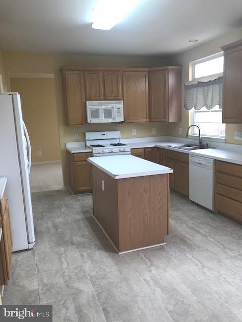 2025 Germander Way Woodbridge, VA 22192 - Photo 9 of 39 a kitchen with stainless steel appliances granite countertop a sink stove and refrigerator