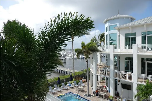 a view of balcony with plants and outdoor seating