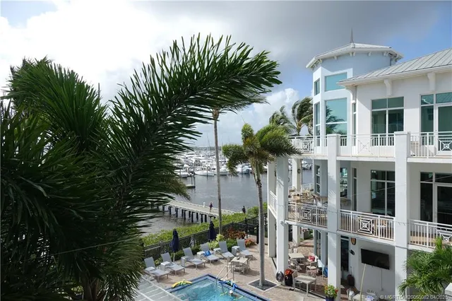 a view of balcony with plants and outdoor seating