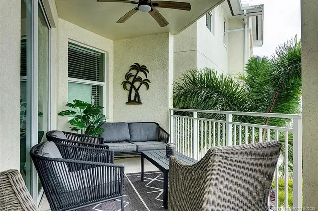 a view of balcony with furniture and potted plant