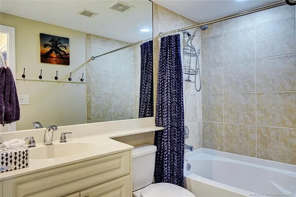 a bathroom with a bathtub a sink and a shower