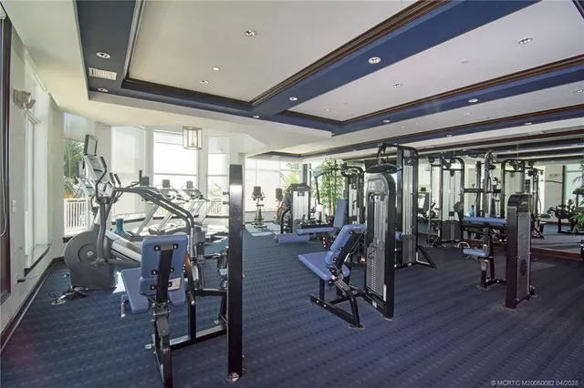a view of a room with lots of chairs and wooden floor