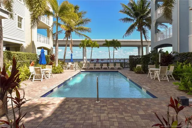 a view of a swimming pool with a patio