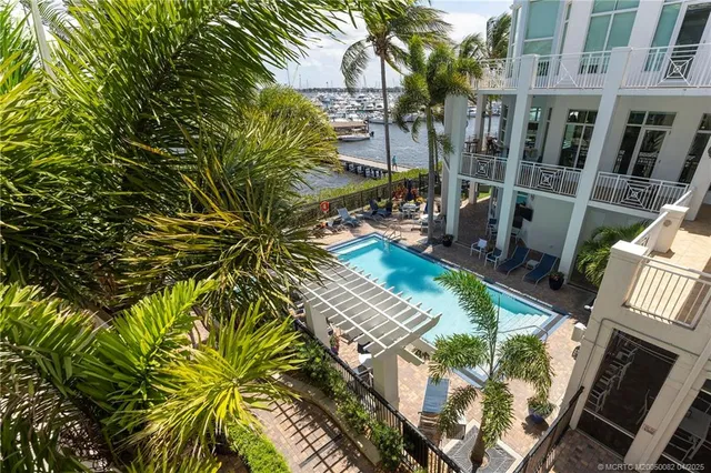 a view of swimming pool with outdoor seating