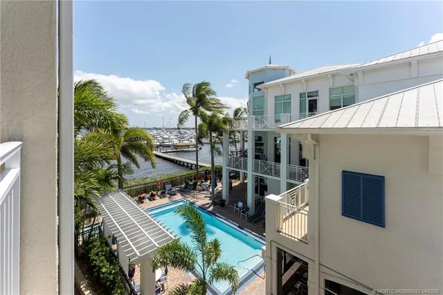 a view of balcony with two chairs and a table