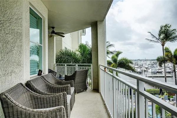 a balcony with table and chairs