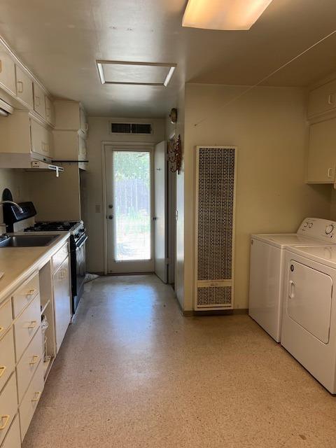 2060 Gettysburg Avenue Clovis, CA 93611 - Photo 35 of 40 a kitchen with window and white cabinets