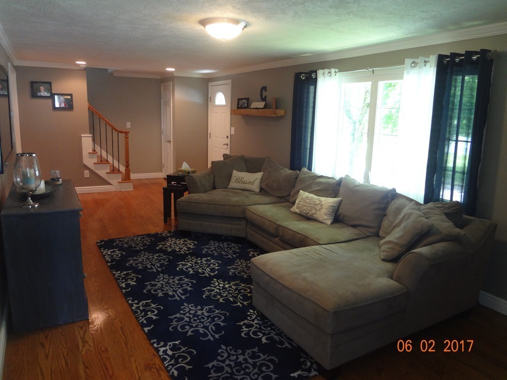 81 Calley Street Springfield, MA 01129 - Photo 3 of 26 a living room with furniture and a rug