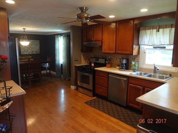 81 Calley Street Springfield, MA 01129 - Photo 9 of 26 a kitchen with wooden cabinets and a sink